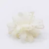 Feather And Flower Fascinator In Cream